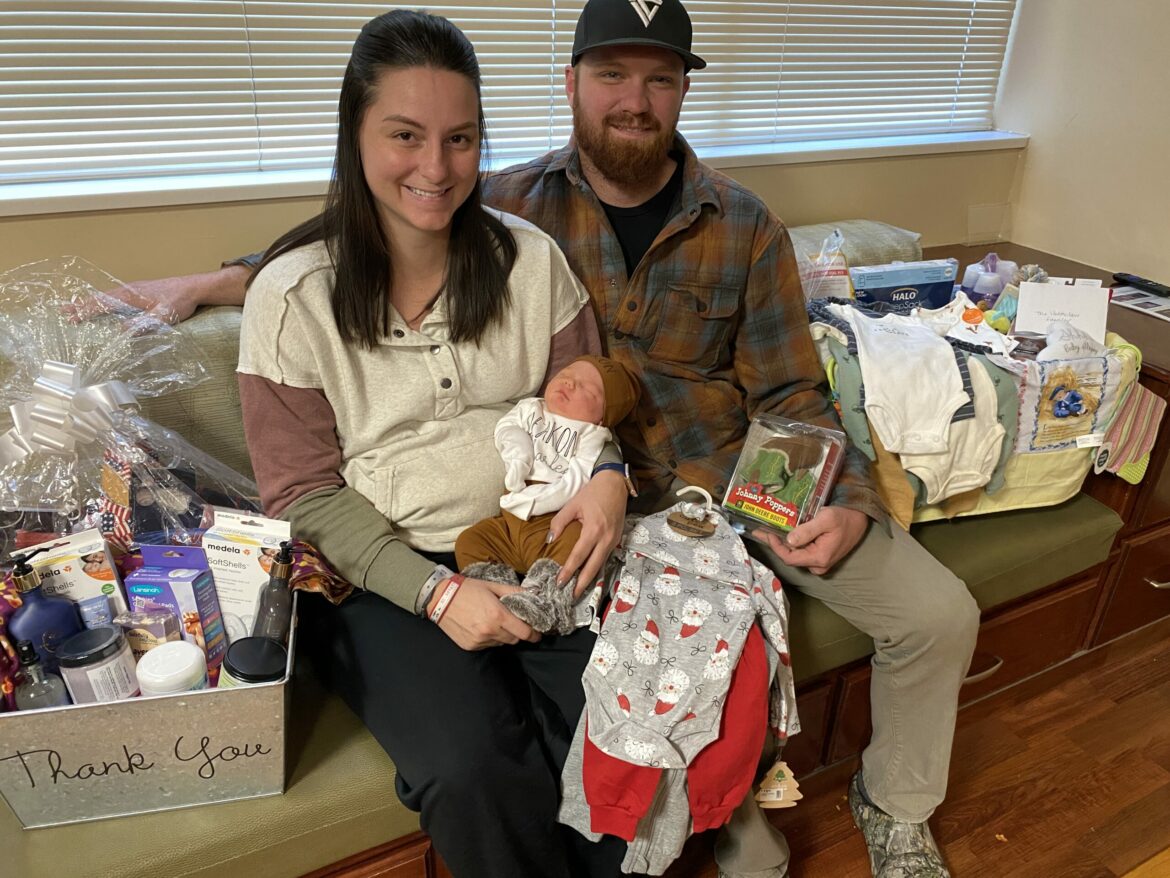 Parent holding newborn baby