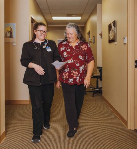 two nurses reviewing paper